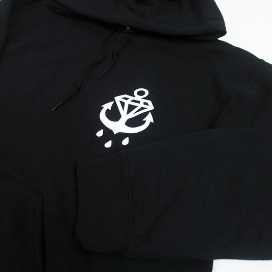 A Phase Black hoodie from Stay Sick Clothing with a white anchor, diamond, and three water droplets graphic on the left chest.