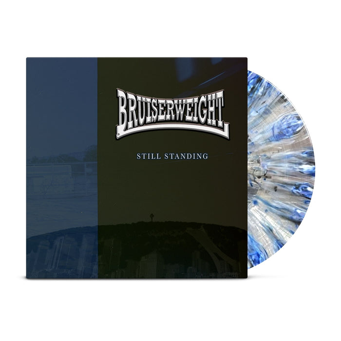 Bruiserweight vinyl record with blue, white, and black splatter design partially in sleeve. Album cover features BRUISERWEIGHT above STILL STANDING over a dark cityscape—ideal for presale or album release events.