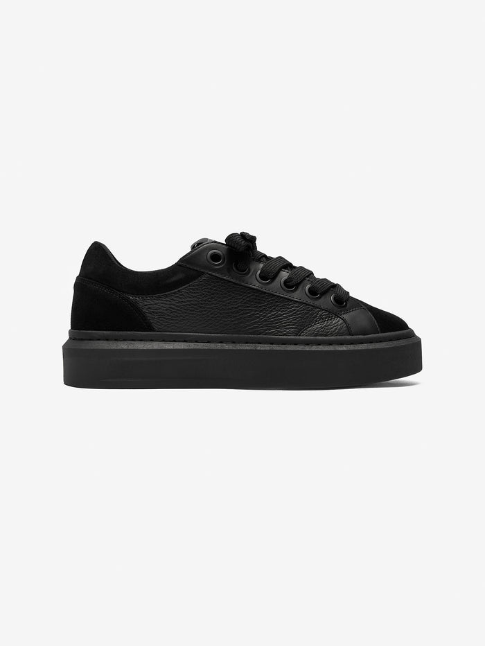 Black smart trainer on a white background