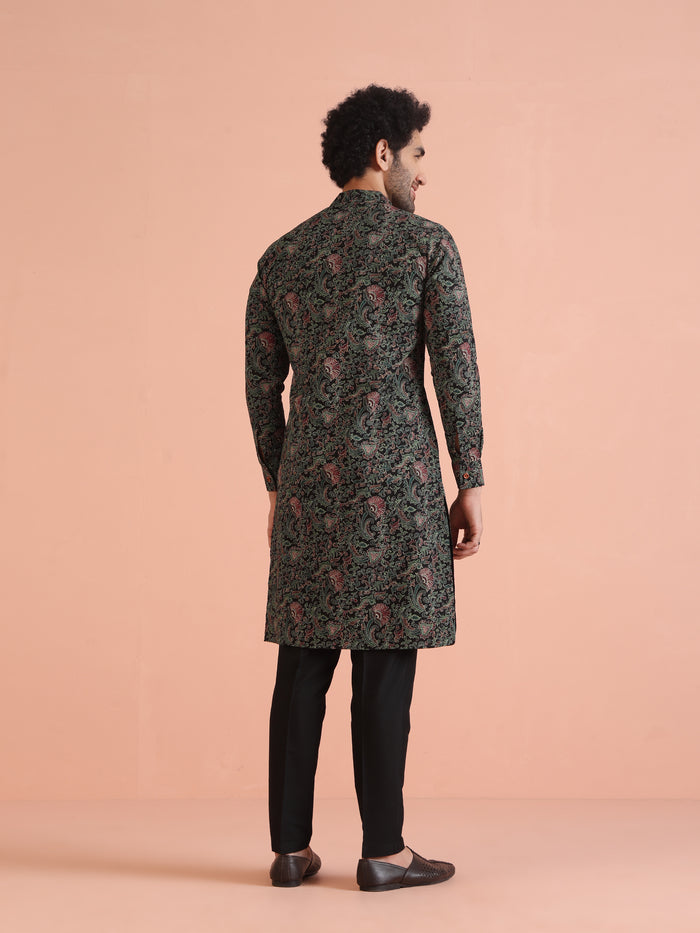 The backside of the model is highlighted, wearing Black Printed Cotton Silk Kurta Trouser Set of Kisah.