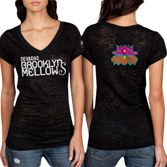 A woman models a Devadas black V-neck T-shirt featuring DEVADAS BROOKLYN MELLOWS text on the front and a colorful lotus flower design on the back, shown in both front and back views.