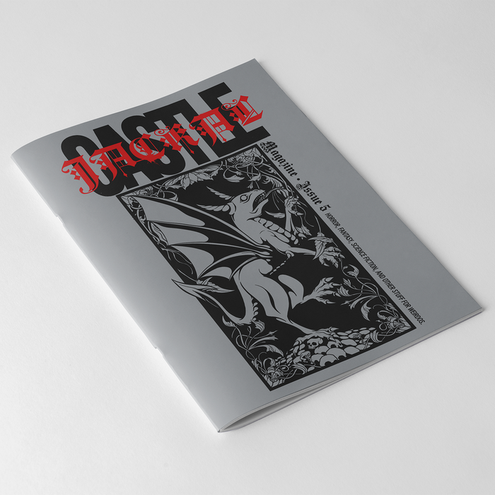 A gray Castle Jackal magazine titled CASTLE features a gothic dragon cover illustration and red ISSUE 12 text at the top, placed on a white surface.