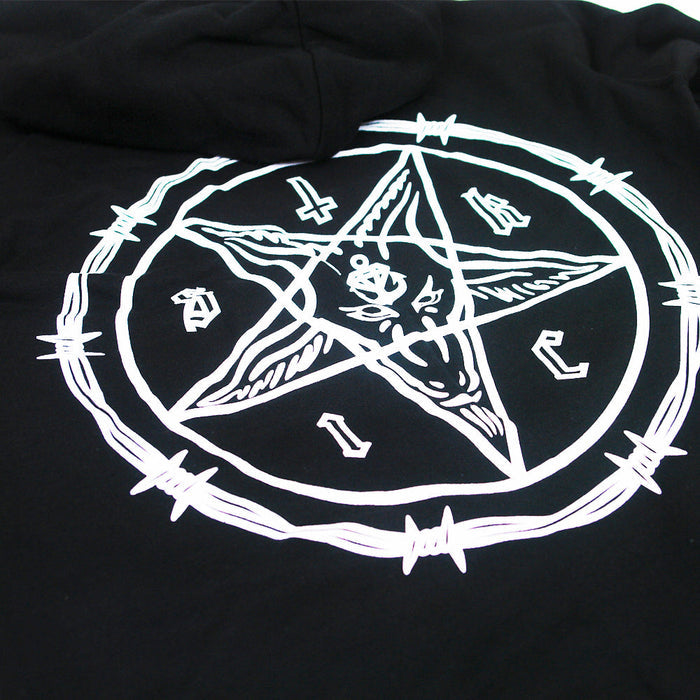 A white pentagram with a goat’s head and barbed wire is printed on cult black Stay Sick Clothing, likely a hoodie or shirt, with letters and symbols arranged around the points.