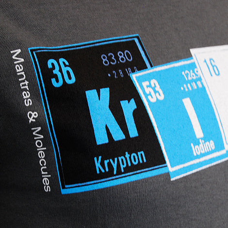 A close-up of a Mantralogy shirt with stylized periodic table elements Krypton (Kr, 36) and Iodine (I, 53), plus Mantras & Molecules text along the side.