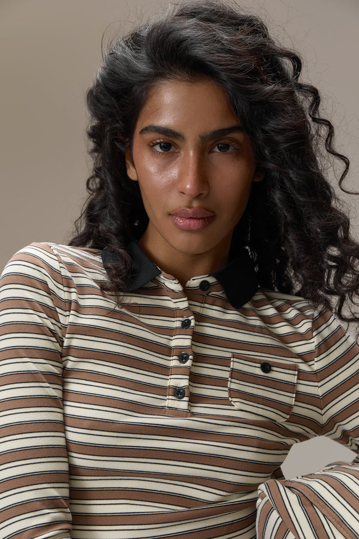 Model is 5'9.5" and size S.