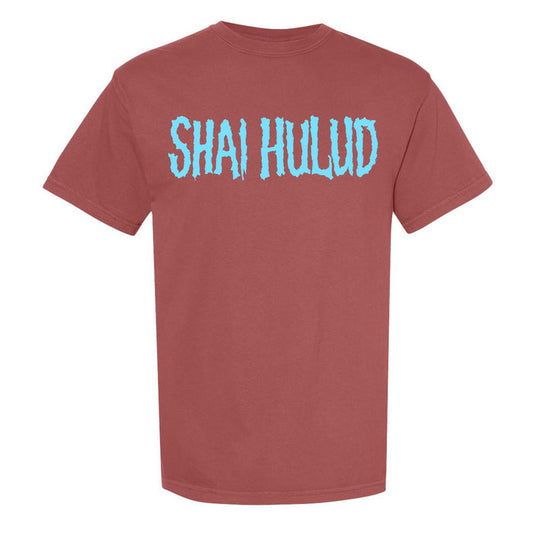 A brick color Comfort Colors t-shirt by Shai Hulud featuring large, light blue, textured SHAI HULUD lettering across the chest.