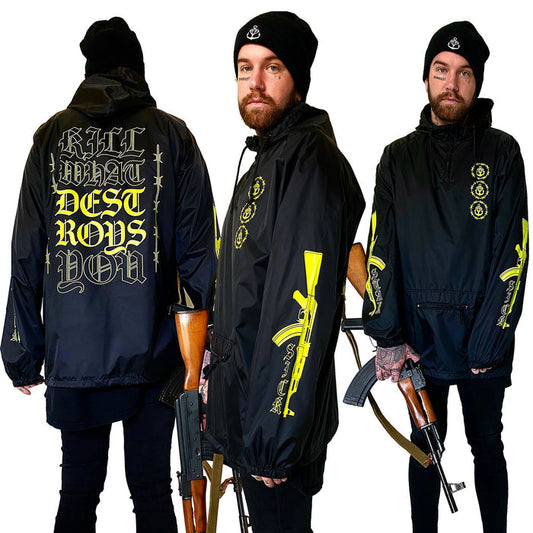 Three views of a man in a Stay Sick Clothing black beanie and Gang Black Pullover with bold yellow graphics, holding a rifle. The back of the windbreaker reads “KILL WHAT DESTROYS YOU.”.