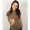 A woman with long brown hair, hoop earrings, and a Mantralogy brown t-shirt featuring an accordion graphic smiles at the camera, expressing her vibrant lifestyle and love for Kirtan music against a plain white background.
