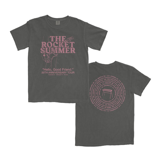 A dark gray Comfort Colors T-shirt by The Rocket Summer with pink text: THE ROCKET SUMMER and Hello, Good Friend 20th Anniversary Tour on the front; tour cities circle a table graphic on the back.