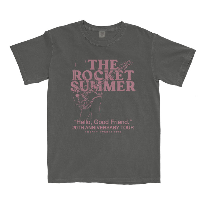 The Rocket Summer gray garment-dyed T-shirt features pink lettering and a guitar player sketch. Text: THE ROCKET SUMMER, Hello, Good Friend. 20th Anniversary Tour, Twenty Twenty Five. Soft ring-spun cotton for comfort.