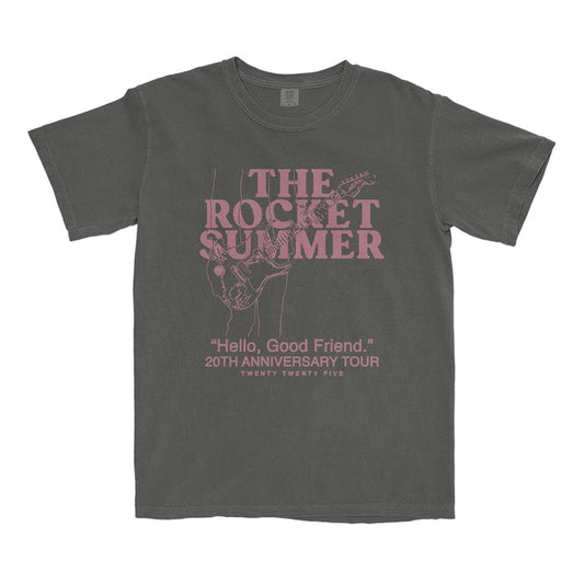 The Rocket Summer gray garment-dyed T-shirt features pink lettering and a guitar player sketch. Text: THE ROCKET SUMMER, Hello, Good Friend. 20th Anniversary Tour, Twenty Twenty Five. Soft ring-spun cotton for comfort.