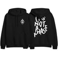 Stay Sick Clothing’s Phase Black hoodie shown from front and back: the front has a small white anchor on the left chest, while the back features large bold white text reading “ITS NOT A PHASE.”.