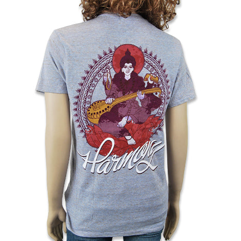 A mannequin wears a gray Mantralogy T-shirt featuring an illustrated figure playing a stringed instrument, a circular decorative pattern, and the word Harmony written below in script.