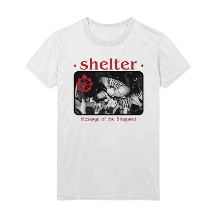 Shelter classic fit white T-shirt, 100% cotton, features a black-and-white crowd surfing photo, shelter in bold red above, a red symbol left of the image, and Message of the Bhagavat below.
