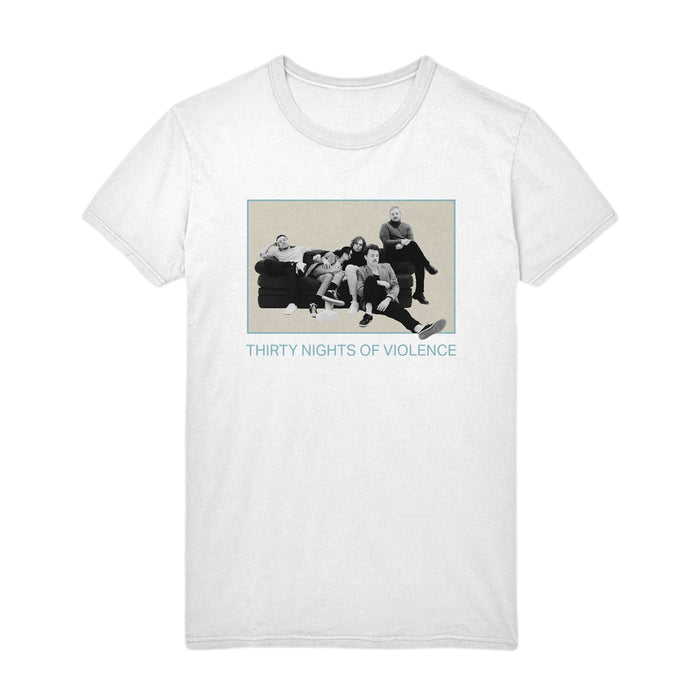 White Thirty Nights of Violence Comfort Colors T-Shirt in soft ring-spun cotton, with a black-and-white photo of five people on a couch and blue THIRTY NIGHTS OF VIOLENCE text below the image.
