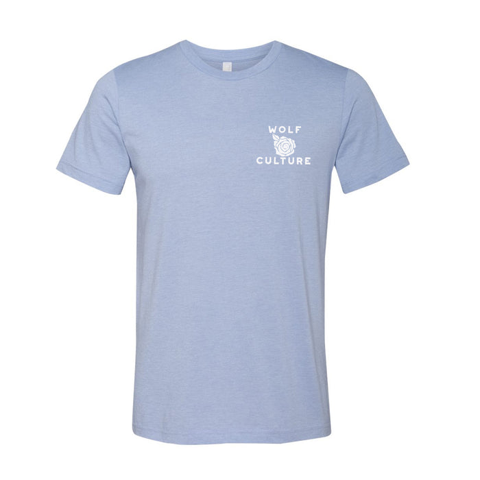 Wolf Culture light blue short-sleeve t-shirt featuring a small white WOLF CULTURE graphic with a wolf head line drawing on the left chest.