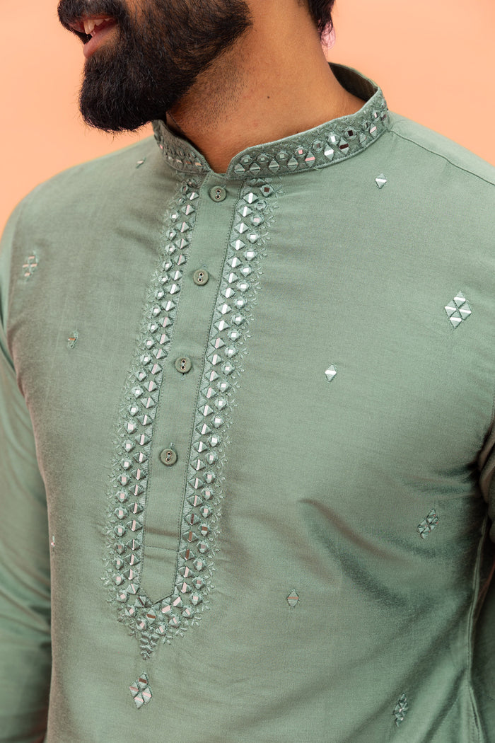 Close-up view highlights mirror work detailing on Kisah Sage Green Kurta with Dhoti, showing neckline embroidery clearly