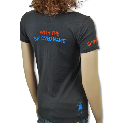 A person shown from behind wears a dark gray Mantralogy t-shirt with orange and blue WITH THE BELOVED NAME text on the back and SHYAM on the sleeve.